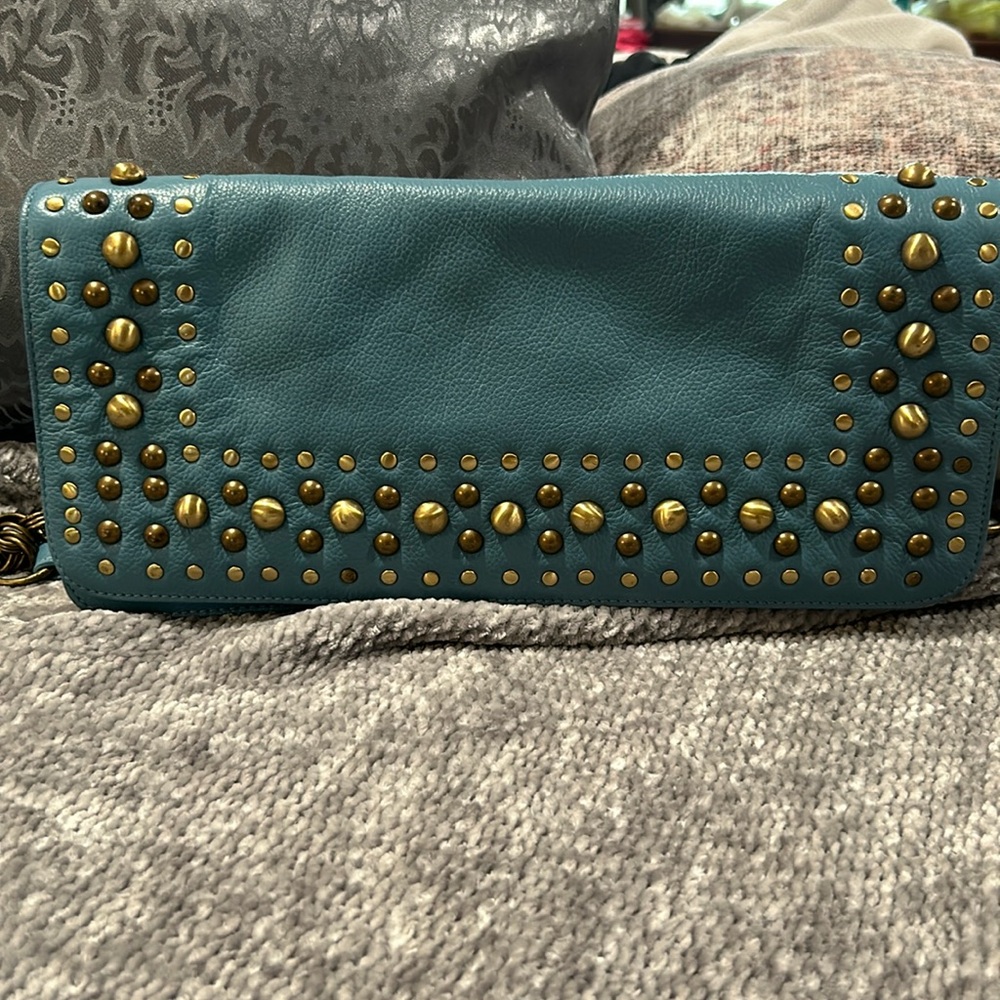 Perfect condition leather handbag Cute studs and chain on the strap.